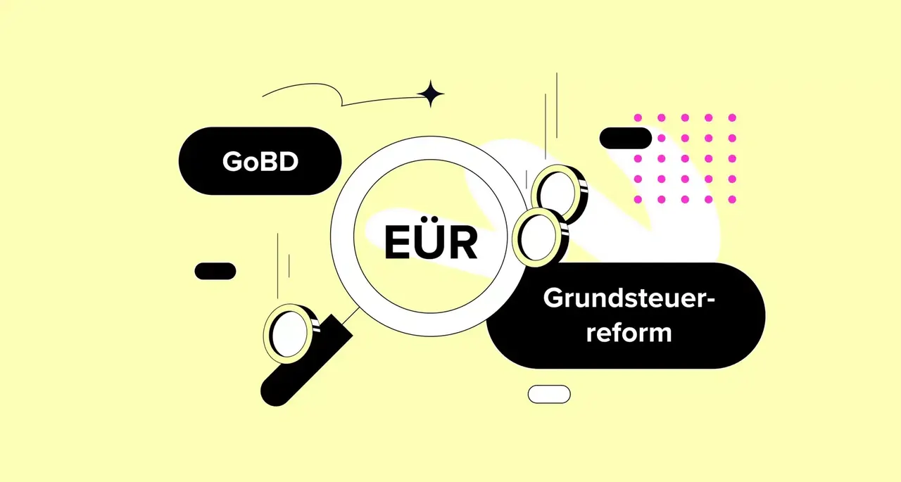 Illustration: Lupe mit EÜR, GoBD und Grundsteuerreform